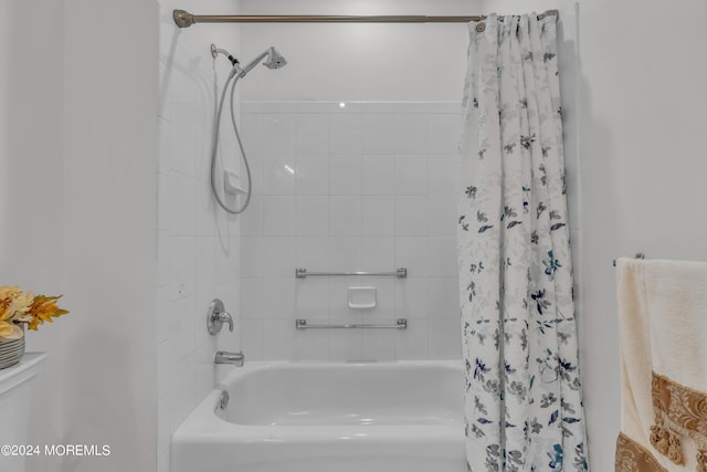 bathroom with shower / bathtub combination with curtain