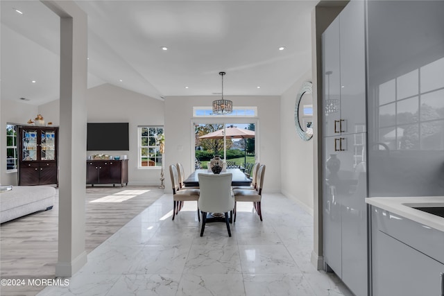 dining area featuring lofted ceiling