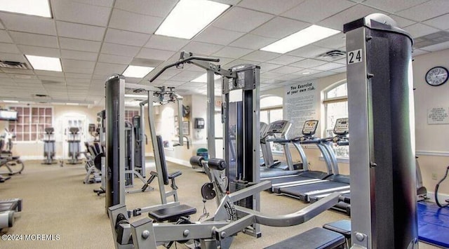 exercise room with a drop ceiling