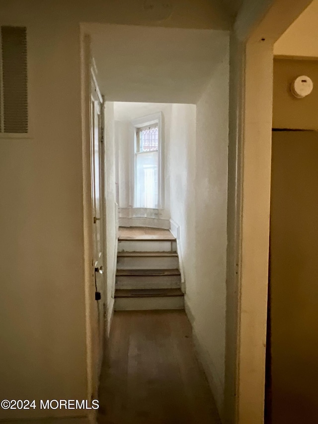 912 W State St, Trenton, NJ 08618 - corridor featuring wood finished floors and stairs