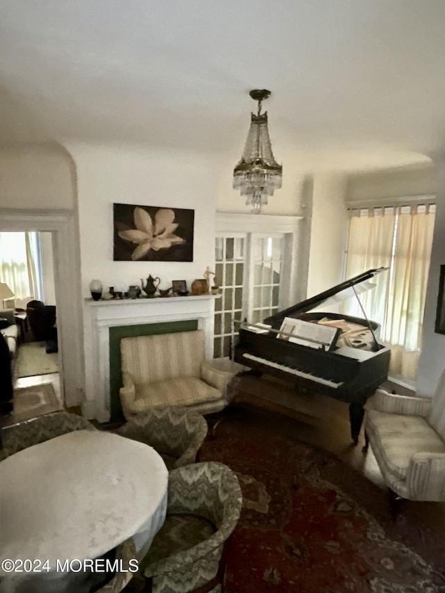 912 W State St, Trenton, NJ 08618 - sitting room featuring a fireplace and a chandelier