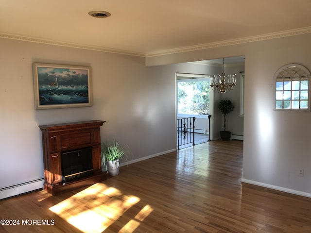 unfurnished living room with baseboard heating, a chandelier, dark wood-type flooring, and ornamental molding