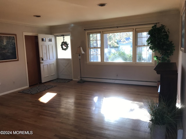 entryway with dark hardwood / wood-style flooring, a baseboard radiator, and crown molding