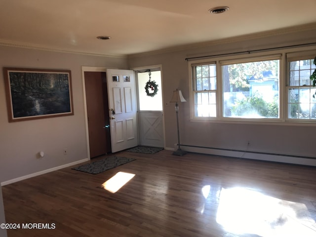 entryway with crown molding, dark wood-type flooring, and a baseboard radiator