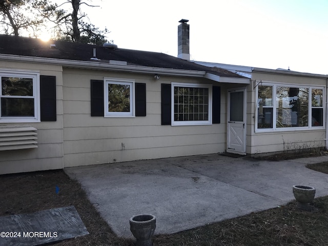 back of property with a patio area