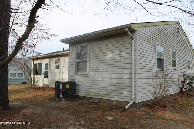 view of side of property with central AC unit