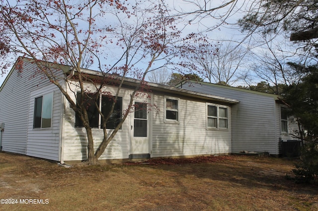 back of property featuring central AC unit