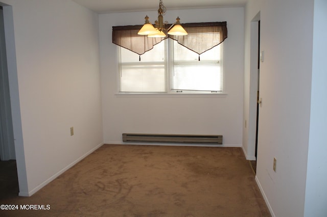 unfurnished dining area featuring carpet floors, baseboard heating, and an inviting chandelier