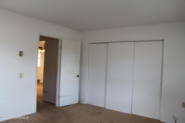 unfurnished bedroom featuring a closet