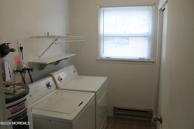 washroom featuring electric water heater, a baseboard radiator, and washing machine and clothes dryer