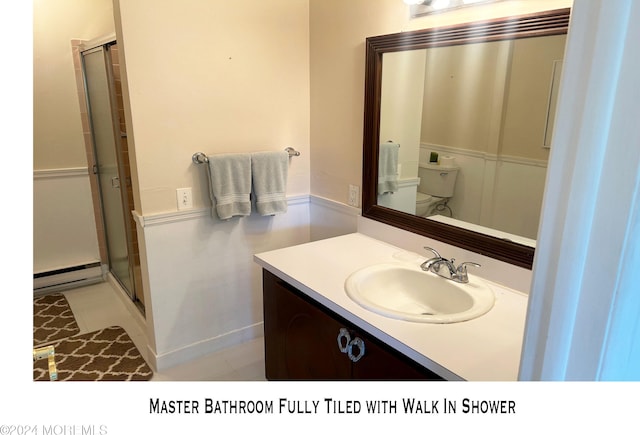 bathroom with vanity, a baseboard radiator, tile patterned flooring, toilet, and a shower with shower door