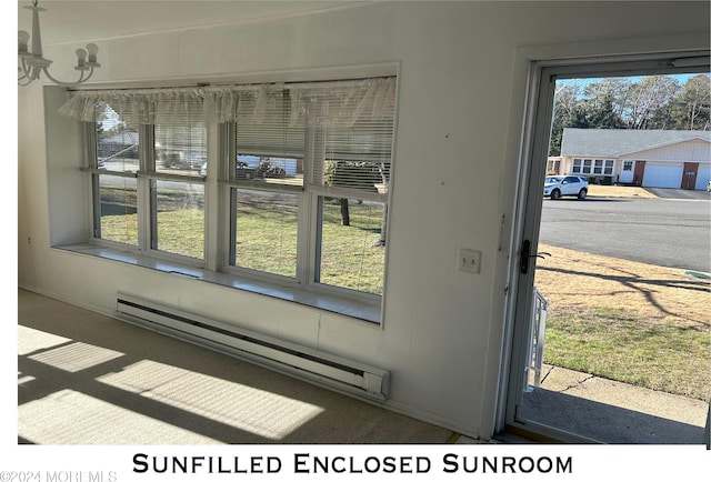 room details with carpet flooring and a baseboard heating unit