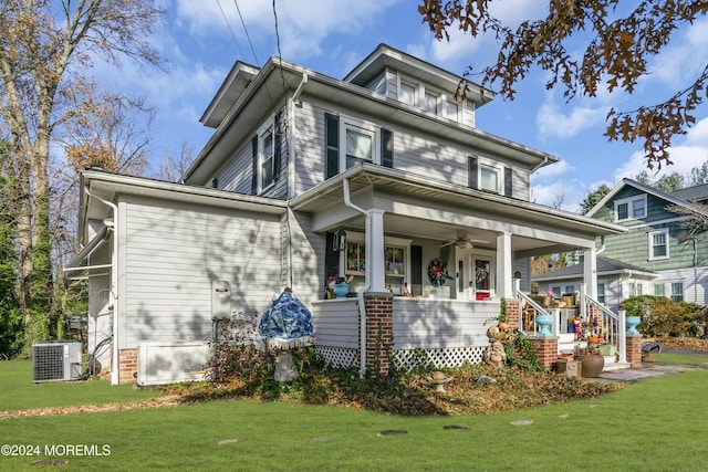 view of front of home with a front lawn, a porch, and cooling unit