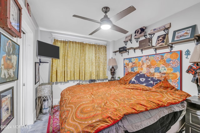 bedroom featuring ceiling fan and light hardwood / wood-style floors