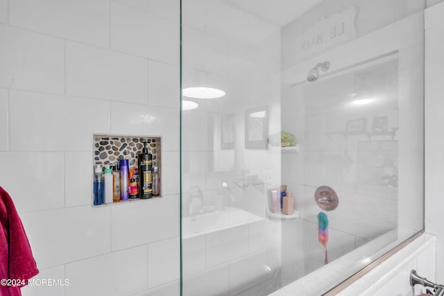 bathroom with tiled shower