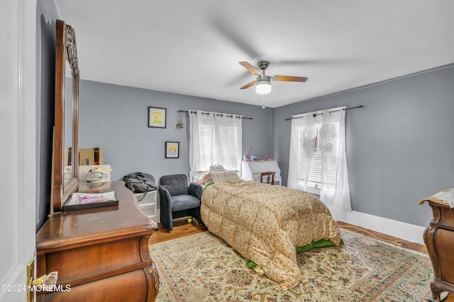 bedroom featuring hardwood / wood-style flooring and ceiling fan