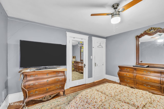 bedroom with ceiling fan and light hardwood / wood-style floors