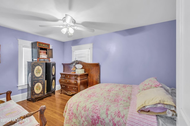 bedroom featuring ceiling fan and hardwood / wood-style flooring