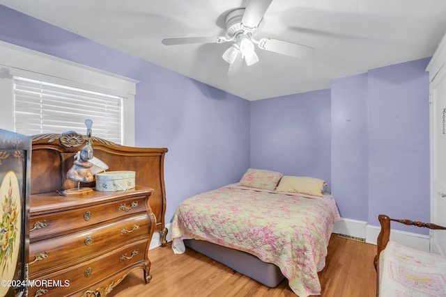 bedroom featuring wood-type flooring and ceiling fan