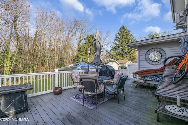 wooden deck with grilling area