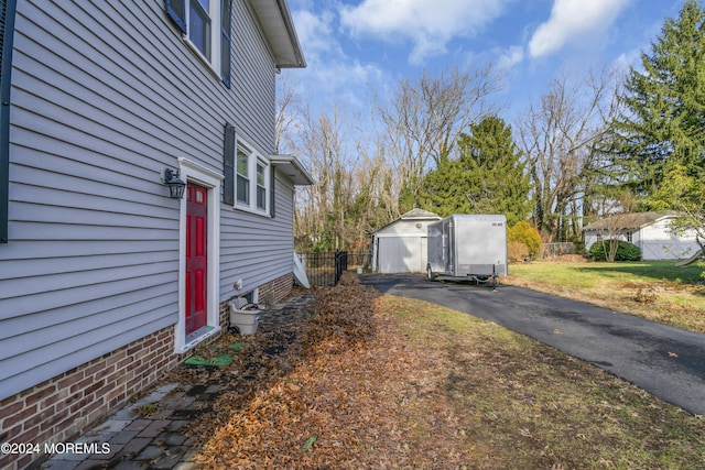 view of side of property with an outdoor structure