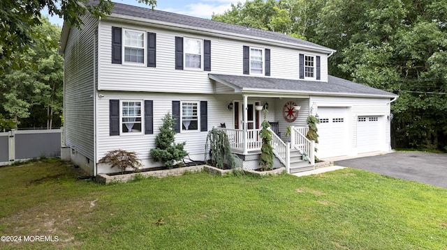 view of front of property featuring a front lawn and a garage