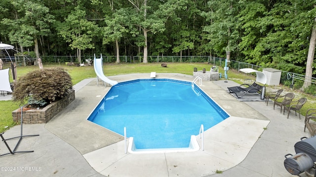 369 Frank Applegate Rd, Jackson, NJ 08527 - view of swimming pool with a fenced backyard, a diving board, a patio, a water slide, and view of wooded area