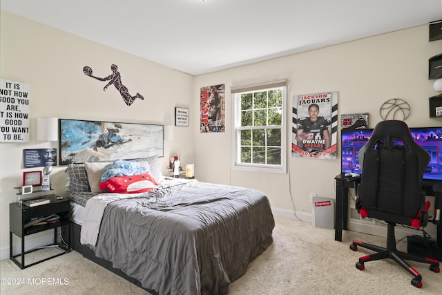 bedroom featuring light carpet