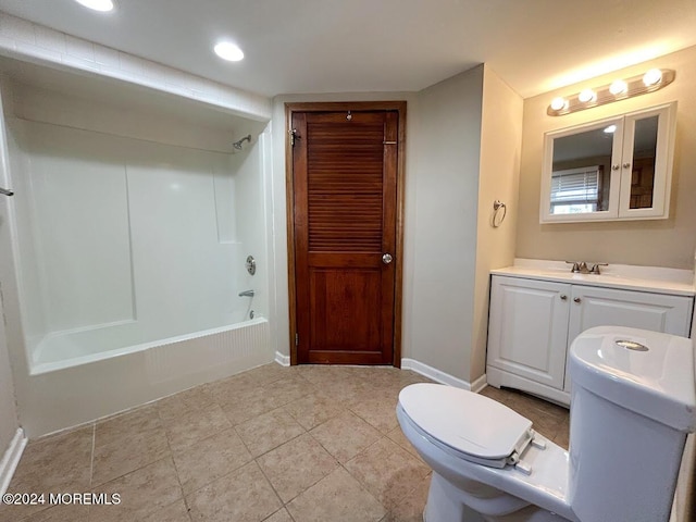 full bathroom with tile patterned flooring, vanity, bathing tub / shower combination, and toilet