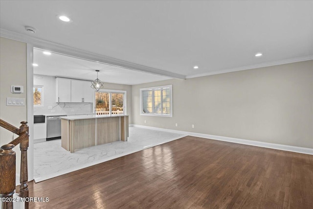 kitchen with white cabinetry, dishwasher, light hardwood / wood-style floors, and decorative light fixtures