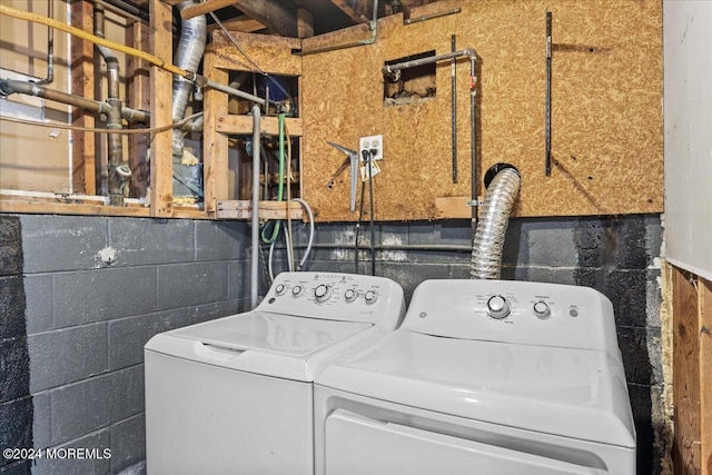 laundry area with independent washer and dryer