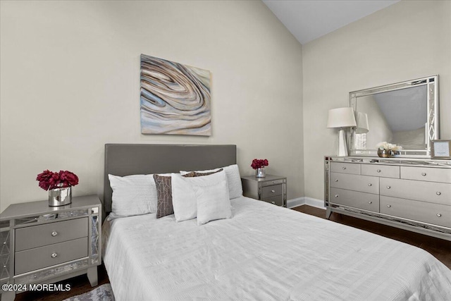 bedroom featuring dark hardwood / wood-style floors and vaulted ceiling