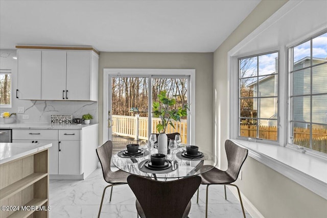 dining space with a healthy amount of sunlight