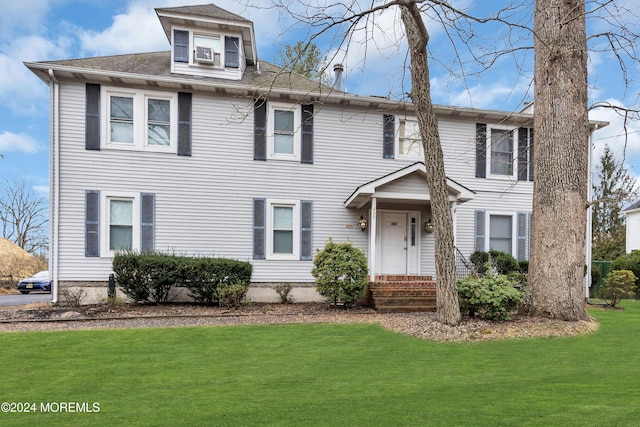 view of front of house with a front lawn