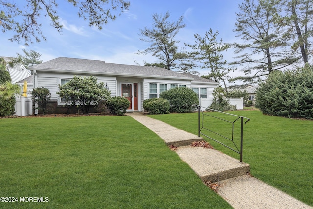 ranch-style house featuring a front lawn