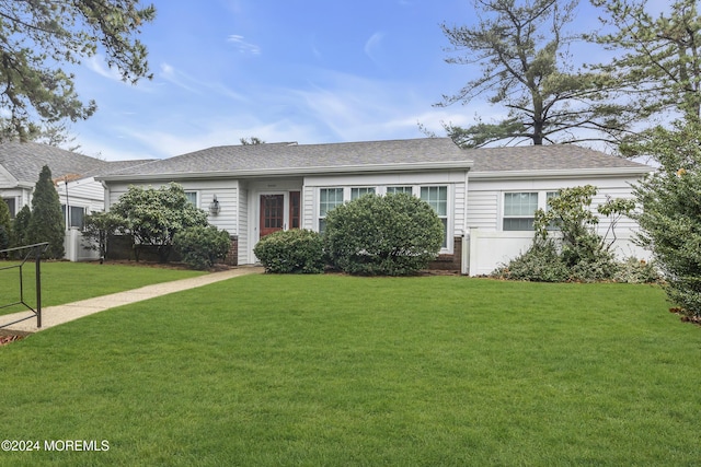 ranch-style home with a front yard