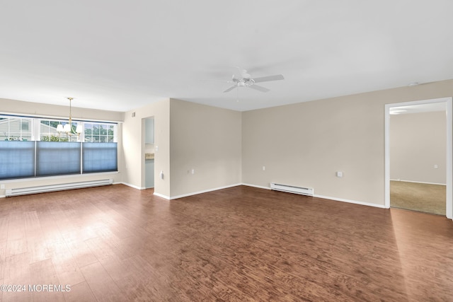 interior space with ceiling fan with notable chandelier, dark hardwood / wood-style floors, and baseboard heating