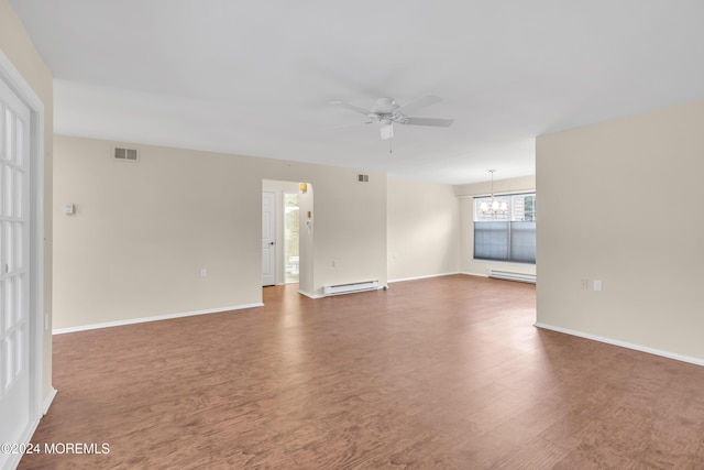 unfurnished room featuring dark hardwood / wood-style flooring, ceiling fan with notable chandelier, and a baseboard radiator