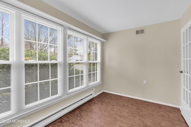 spare room featuring a baseboard heating unit