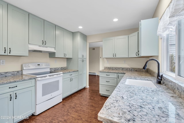 kitchen featuring light stone counters, white electric range oven, baseboard heating, dark wood-type flooring, and sink