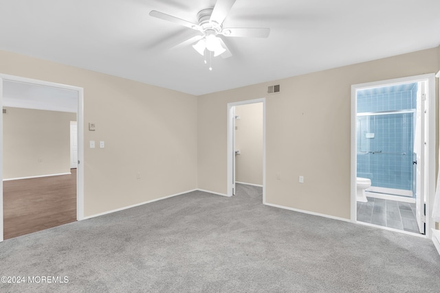 carpeted empty room featuring ceiling fan