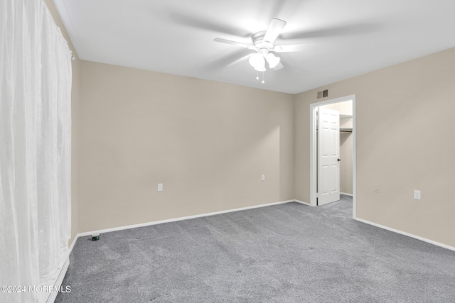 unfurnished room featuring carpet and ceiling fan