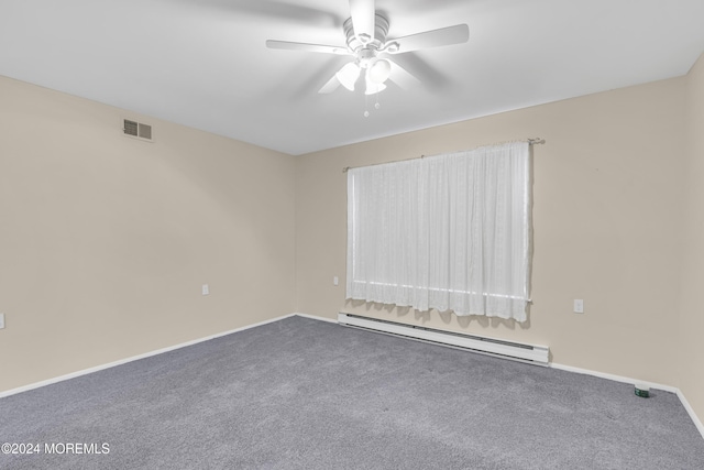 carpeted empty room featuring ceiling fan and a baseboard heating unit