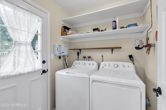 laundry area with washing machine and clothes dryer