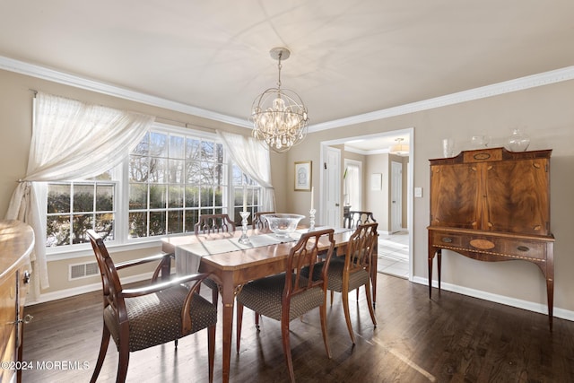 dining room with dark hardwood / wood-style flooring, an inviting chandelier, and ornamental molding