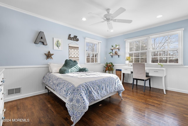 bedroom featuring dark hardwood / wood-style flooring, ceiling fan, and crown molding