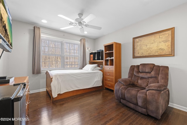 bedroom featuring dark hardwood / wood-style flooring and ceiling fan