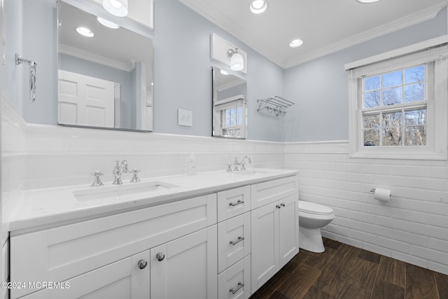 bathroom featuring wood-type flooring, toilet, tile walls, and a healthy amount of sunlight