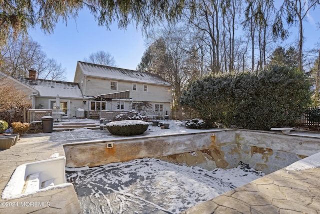 view of snow covered pool