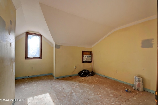 additional living space featuring lofted ceiling